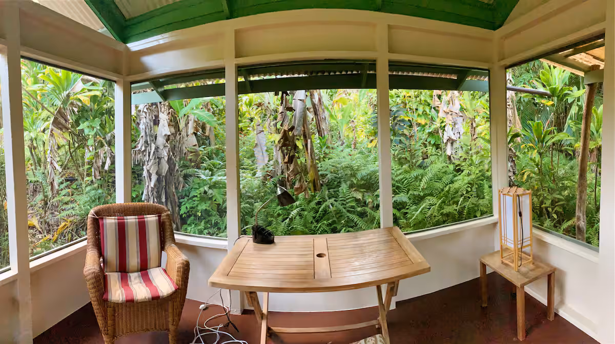 Banana Patch Cottage exterior nestled in tropical vegetation